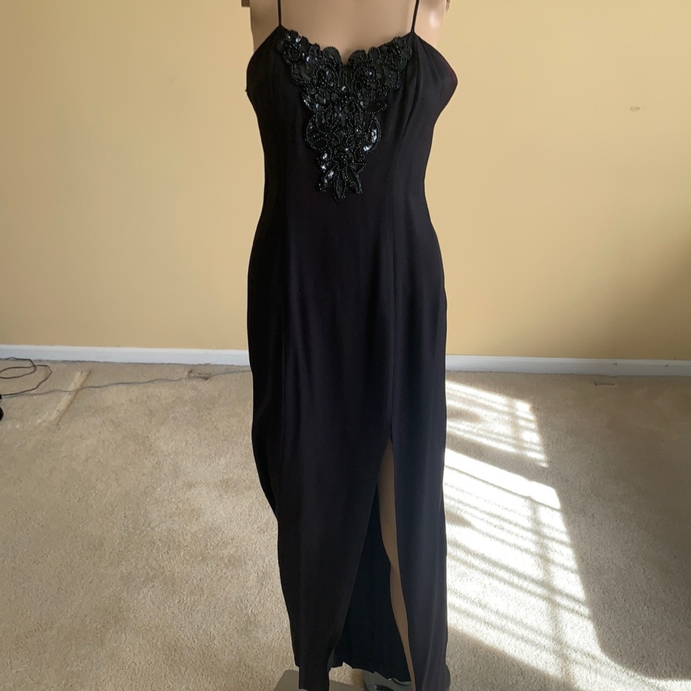 Sexy black gown with embroidered top and slit of the leg